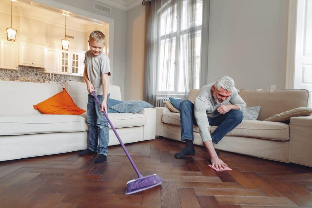 man and boy cleaning floor